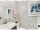 Charming bathroom with a modern sink, stylish fixtures, a window, and neutral color scheme at 1124 E 35Th St, Indianapolis, IN 46205