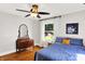 Bedroom with hardwood floors, neutral walls, ceiling fan, and two windows at 1124 E 35Th St, Indianapolis, IN 46205