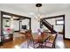 Charming dining room features a wooden table, chandelier, and views into the living room and stairway at 1124 E 35Th St, Indianapolis, IN 46205
