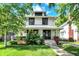 Charming two-story home with a covered porch and a well-manicured front yard at 1124 E 35Th St, Indianapolis, IN 46205