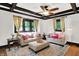 Inviting living room with hardwood floors, coffered ceilings, neutral sofas, and bright, decorative accents at 1124 E 35Th St, Indianapolis, IN 46205