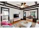 Open living space featuring hardwood floors, coffered ceilings, view of kitchen, and comfortable sofas at 1124 E 35Th St, Indianapolis, IN 46205