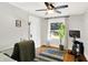 Cozy home office featuring a ceiling fan, natural light, and hardwood floors at 1124 E 35Th St, Indianapolis, IN 46205