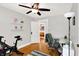 Home office with hardwood floors, white shelving, and access to an adjacent room at 1124 E 35Th St, Indianapolis, IN 46205