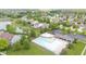 Aerial view of community with pool and surrounding homes, landscaping and pond at 11243 Catalina Dr, Fishers, IN 46038
