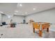 Spacious finished basement with neutral carpeting, recessed lighting, and ample space for recreation at 11243 Catalina Dr, Fishers, IN 46038