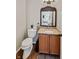 Bathroom with granite countertop, wood cabinet, modern sink, and new paint at 11243 Catalina Dr, Fishers, IN 46038
