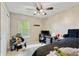 Comfortable bedroom with a full-sized bed, desk, and lots of natural light at 11243 Catalina Dr, Fishers, IN 46038