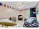bedroom featuring two twin beds, playful nautical decor, and a ceiling fan at 11243 Catalina Dr, Fishers, IN 46038