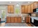 Well-equipped kitchen with wooden cabinets, granite countertops, and stainless steel appliances at 11243 Catalina Dr, Fishers, IN 46038