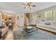 Spacious living room with hardwood floors and open access to the kitchen and stairway at 11243 Catalina Dr, Fishers, IN 46038