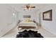 Bright bedroom features a neutral color palette, wooden bed frame, and comfortable carpet flooring at 11243 Catalina Dr, Fishers, IN 46038