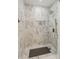 Shower with marble tile, a shower head, and a ledge for toiletries at 11243 Catalina Dr, Fishers, IN 46038