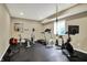 Home gym in basement with weight training equipment, treadmill and stationary bicycle at 11323 Still Creek Dr, Zionsville, IN 46077
