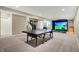 Basement featuring ping pong table, golf simulator and basketball hoop for entertainment at 11323 Still Creek Dr, Zionsville, IN 46077