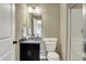 Stylish bathroom featuring granite countertop, dark wood cabinets and a glass door shower at 11323 Still Creek Dr, Zionsville, IN 46077