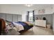 Cozy bedroom with stylish wainscoting, comfortable bed, and plenty of natural light at 11323 Still Creek Dr, Zionsville, IN 46077