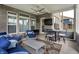Covered brick patio with comfortable seating and a view of the backyard at 11323 Still Creek Dr, Zionsville, IN 46077