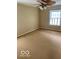 Neutral bedroom with a ceiling fan and a window, offering a serene and comfortable living space at 1138 E 58Th St, Indianapolis, IN 46220