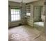 Bedroom with carpet, natural light, and built-in shelving and mirrored closet at 1138 E 58Th St, Indianapolis, IN 46220