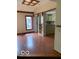 Open dining area with tile flooring that flows into a kitchen and a window providing lots of natural light at 1138 E 58Th St, Indianapolis, IN 46220