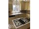 Kitchen with gas stove, white sink, and neutral color cabinets at 1138 E 58Th St, Indianapolis, IN 46220