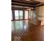 Spacious living room with polished concrete floors, custom cabinets, and large windows offering serene views at 1138 E 58Th St, Indianapolis, IN 46220