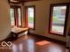 Living room featuring red framed windows, terracotta tiled floor and window seat at 1138 E 58Th St, Indianapolis, IN 46220