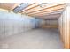 A large unfinished basement with exposed beams and concrete walls provides ample space at 11473 Rainbow Falls Ln, Fishers, IN 46037