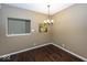 Dining area with hardwood floors and modern chandelier lighting at 11473 Rainbow Falls Ln, Fishers, IN 46037