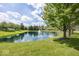 Scenic pond view with fountain and lush greenery in the community at 11473 Rainbow Falls Ln, Fishers, IN 46037