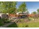 Landscaped backyard with mature trees, an outdoor pergola, and a garden provides a private and tranquil setting at 1157 Fielding Ln, Franklin, IN 46131