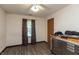 Bedroom with wood floor, ceiling fan, window, and portable tool storage at 1157 Fielding Ln, Franklin, IN 46131