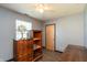 Bedroom featuring wood dresser, open shelving, and wood floor at 1157 Fielding Ln, Franklin, IN 46131