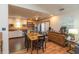 Dining area featuring a wood table set, access to the kitchen, and a door to the backyard at 1157 Fielding Ln, Franklin, IN 46131