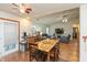 Open dining area with views of the living room, stainless steel refrigerator, and outdoor access at 1157 Fielding Ln, Franklin, IN 46131