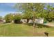 Charming single-story home surrounded by lush green lawn and mature trees at 1157 Fielding Ln, Franklin, IN 46131