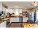 Bright kitchen with white cabinetry, stainless steel appliances, wood countertop, and ample storage at 1157 Fielding Ln, Franklin, IN 46131