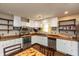 Bright kitchen with white cabinetry, stainless steel appliances, wood countertop, and ample storage at 1157 Fielding Ln, Franklin, IN 46131