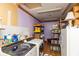 Laundry room with washer, dryer, storage shelves, and purple painted walls at 1157 Fielding Ln, Franklin, IN 46131