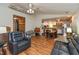Open-concept living room showcasing hardwood floors, open access to the kitchen, and vaulted ceilings at 1157 Fielding Ln, Franklin, IN 46131