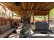 View of backyard patio area with ceiling fan, grill, and ample seating at 1157 Fielding Ln, Franklin, IN 46131
