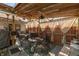 Charming covered patio with comfortable seating, perfect for outdoor entertaining and relaxation with custom wood ceiling at 1157 Fielding Ln, Franklin, IN 46131