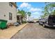 Backyard with a gravel driveway, trash cans, and a view of the back of the house at 1170 E 400 S, Lebanon, IN 46052