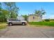 Exterior view of the house with a gravel driveway and a vehicle parked in front at 1170 E 400 S, Lebanon, IN 46052