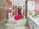 Unique bathroom featuring a heart-shaped tub, patterned wallpaper and carpeted platform at 1209 S Rangeline Rd, Anderson, IN 46012