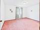 Cozy bedroom with pink carpet and bright natural light at 1209 S Rangeline Rd, Anderson, IN 46012