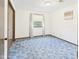 Comfortable bedroom with blue carpet and natural light at 1209 S Rangeline Rd, Anderson, IN 46012