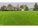 Charming brick home with well-manicured lawn and mature trees at 1209 S Rangeline Rd, Anderson, IN 46012