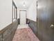 Inviting foyer with paneled walls and neutral-toned carpet at 1209 S Rangeline Rd, Anderson, IN 46012